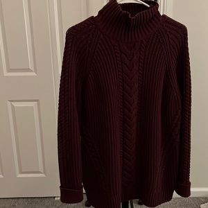 Burgundy slight turtle neck, slightly oversized.